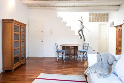 a living room with a table and chairs at Terrazza al Capo by Wonderful Italy in Palermo