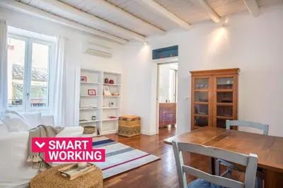 a living room with a table and a dining room at Terrazza al Capo by Wonderful Italy in Palermo