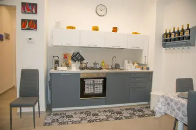 a kitchen with a sink and an oven at MONDELLO MANICK MARE in Palermo