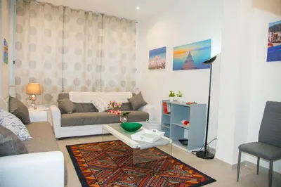 a living room with a couch and a table at MONDELLO MANICK MARE in Palermo