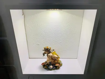 a picture of a figurine in a white frame at Monfenera Apartment 3 in Palermo