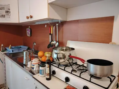 a kitchen with a stove with a pot on it at CASA Spezie 1PD Climatizzata in Castellammare del Golfo