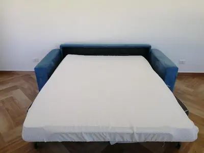 a bed in a room with a blue mattress at Villa Giorgia 2020 in Cefalù