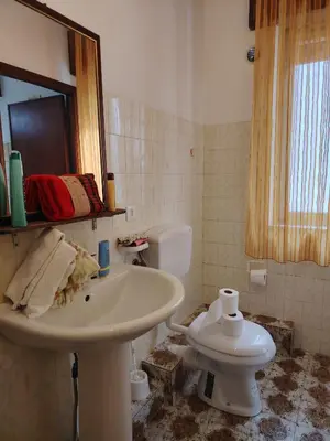 a bathroom with a sink and a toilet at CASA Alle Spezie 1PS Climatizzata in Castellammare del Golfo