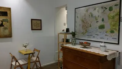 a room with a large map on the wall at Palermo Rooms in Palermo