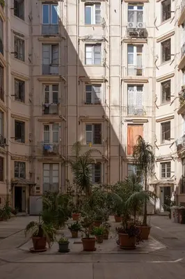 a large building with plants in front of it at Casa Gagliani, a Liberty house in the old downtown in Palermo