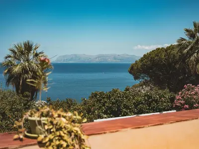 a view of the ocean from a balcony at Villa Claudia in Scopello