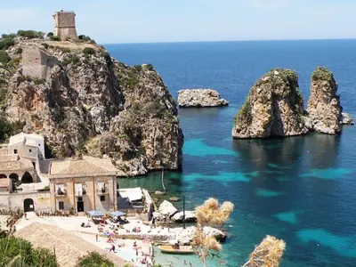 a view of an island with a church and the ocean at Villa Claudia in Scopello