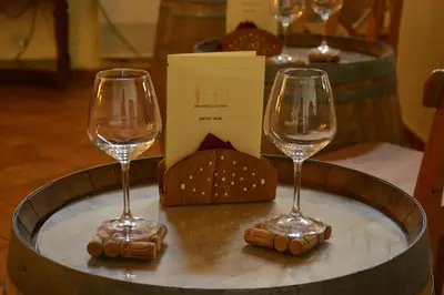 two wine glasses sitting on top of a table at Agriturismo Masseria La Chiusa in San Giuseppe Jato