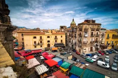 an overhead view of a city with cars parked in a parking lot at Antico vicolo di ballarò in Palermo
