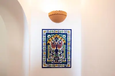 a picture on a wall with a ball on the wall at Villa Blumarine sul mare in San Vito lo Capo
