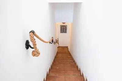a hallway with a rope hanging on a wall at Villa Blumarine sul mare in San Vito lo Capo