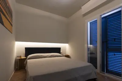 a bedroom with a bed and a window at Villa Turchese sul mare in San Vito lo Capo