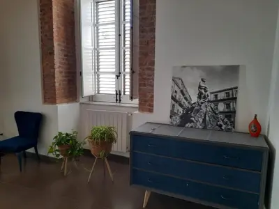 a blue dresser in a room with a window at A Casa del Genio in Palermo