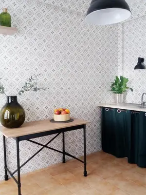 a kitchen with a table with a bowl of fruit on it at villa coral mondello in Palermo