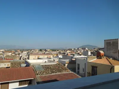 a view of a city with roofs and buildings at Appartamento Sul Golfo in Castellammare del Golfo