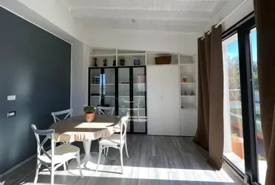 a set of stairs with a window on the side of a building at Rosalia Homestay - Ponente Apartment in Cinisi