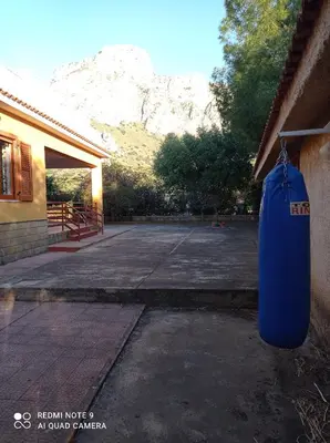 a blue bin hanging from the side of a building at Sunset Cottage in Cinisi