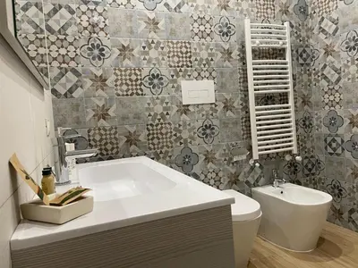 a bathroom with a tub and a toilet and a sink at Elite Residence Mondello in Mondello