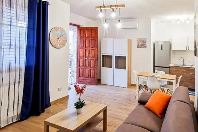 a living room with a couch and a table at Elite Residence Mondello in Mondello