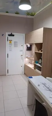 a kitchen with a white door and a white floor at B&B AMISTANZA in Palermo
