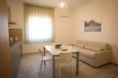 a living room with a couch and a table at Casa Vacanza Barone in Castellammare del Golfo