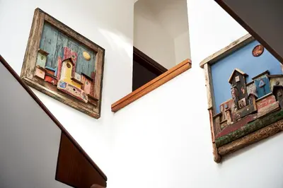 a set of three pictures hanging on a wall at LuminHouse Mondello Valdesi in Palermo