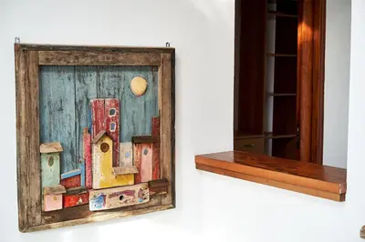 a picture of a painting of a city on a wall at LuminHouse Mondello Valdesi in Palermo