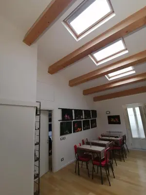 a dining room with tables and chairs and skylights at Ballarooms B&B Palermo Centro in Palermo