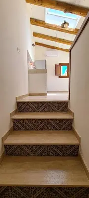 a set of stairs in a room with a window at Voltamare in Castellammare del Golfo