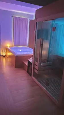 a room with a bed and a glass shower at Archè Design Rooms and Suites in Palermo