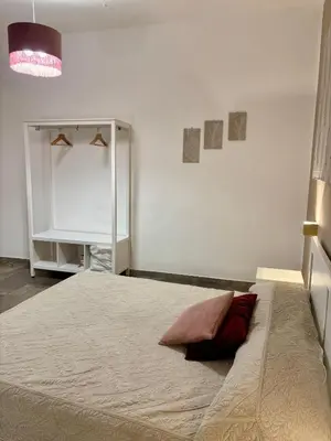 a bedroom with a bed with a pillow on it at Casa Raffadali, in centro storico a Palermo in Palermo