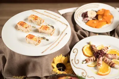 three plates of food on a table at Valle Himara in Piana degli Albanesi