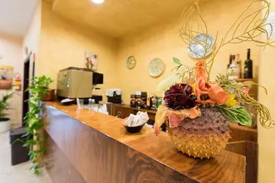 a pineapple centerpiece on a counter in a salon at Valle Himara in Piana degli Albanesi