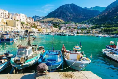 a group of boats are docked in a harbor at Appartamento del Golfo in Castellammare del Golfo
