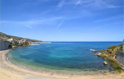 a view of a beach with blue water at Cozy Apartment In Castellammare Dg in Castellammare del Golfo