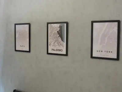 three framed pictures hanging on a wall at Loft - Villa Flore apartments in villa in Casteldaccia