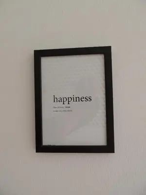 a framed picture of happiness on a wall at Loft - Villa Flore apartments in villa in Casteldaccia