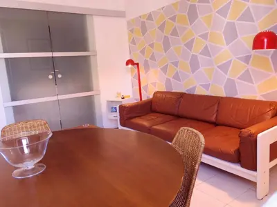 a living room with a table and a couch at home.70 Carini in Palermo