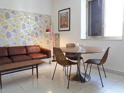 a living room with a couch and a table at home.70 Carini in Palermo