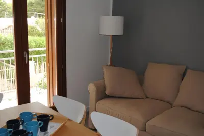a living room with a couch and a table at Villa Smeralda in San Vito lo Capo