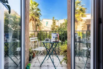 a view from a balcony with a table and chairs at Arimatea Casa Vacanza in Palermo
