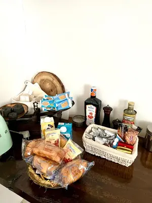 a table topped with food and baskets of food at Case Natoli - Residenze d'Epoca in Palermo