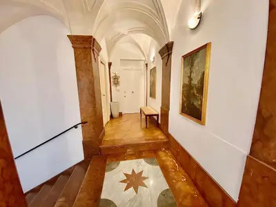 a hallway in a building with a star on the floor at Case Natoli - Residenze d'Epoca in Palermo