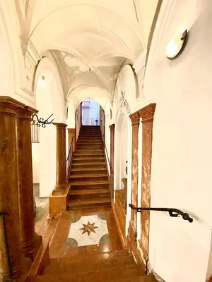 a staircase in an old building with a star on the floor at Case Natoli - Residenze d'Epoca in Palermo