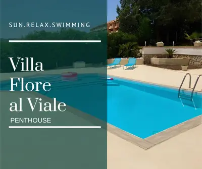 a view of the ocean with a mountain in the background at Villa Flore - Penthouse - apartment in villa in Casteldaccia
