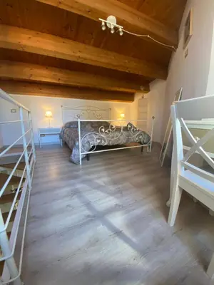a room with a bed and two bunk beds at Il mio posto ai Quattro Canti - Centro storico Palermo in Palermo