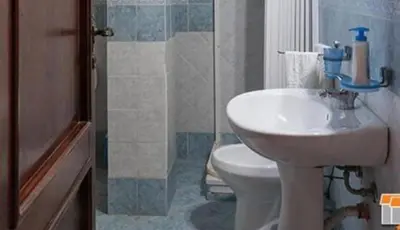 a bathroom with a sink and a toilet at New Island in Isola delle Femmine