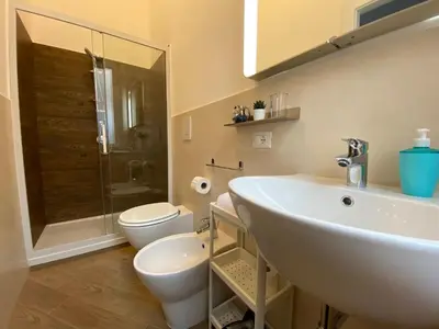 a bathroom with a sink and a toilet and a shower at Lucky Inn, La Locanda della Fortuna in Palermo