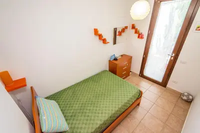 a small room with a bed and a window at Villa Pietro in Lascari